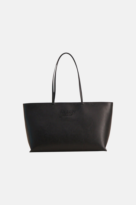 Sac à bandoulière noir TOMMY JEANS avec deux poignées et une surface légèrement grainée.