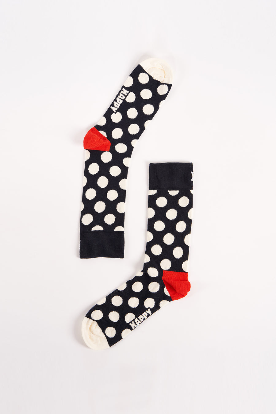 Chaussettes bleues de Happy Socks avec des taches blanches et des détails rouges.