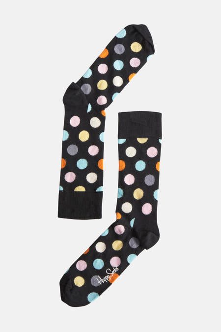 Chaussettes multicolores de Happy Socks, avec un motif à points en bleu, rose, jaune, orange, gris et blanc.