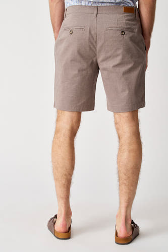 Short beige de Bruce & Butler, vu de de l'ar avec des des po et et etaux m.