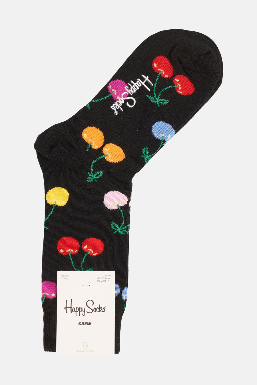 Chaussettes noires avec imprimé de fleurs de Happy Socks et une étiquette en papier.