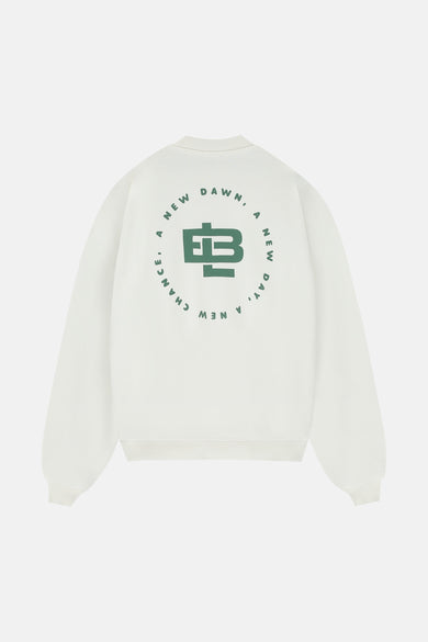 Pull-over blanc de BASELAB avec imprimé vert de cercle et texte sur le dos.