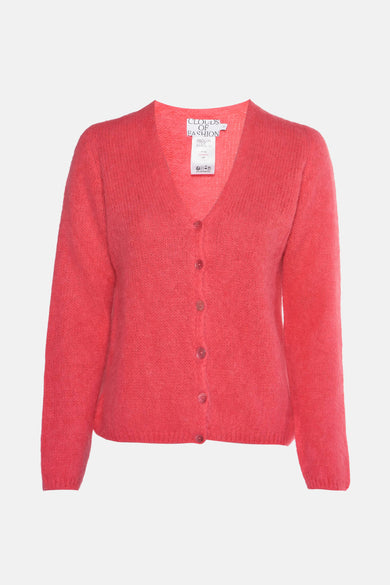 Gilet rose de Clouds of Fashion, avec encol V et fermeture à boutons.