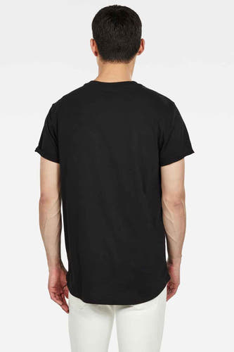 T-shirt noir de G-Star RAW, à manches courtes et d'une couleur unie, avec le dos visible, associé à un pantalon blanc.