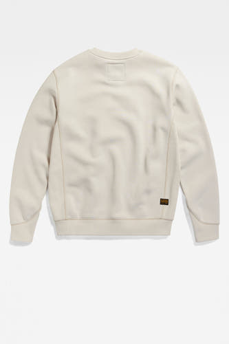 Pull écru à col rond de G-Star RAW, avec un petit logo sur la poitrine.