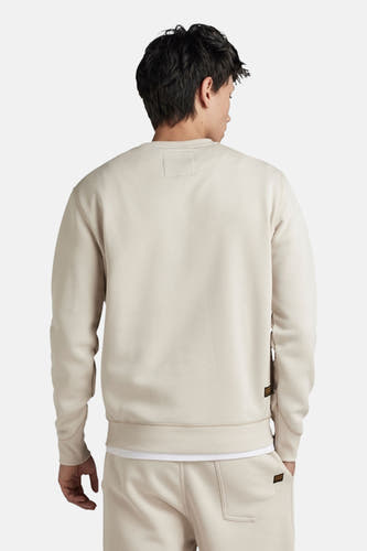 Ecrukleurige sweater met ronde hals van G-Star RAW, gezien van achteren, met subtiel label detail.