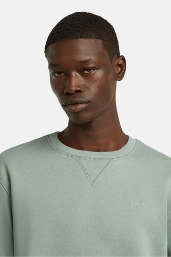 Sweater vert de G-Star RAW, avec une encolure ronde et un petit logo sur la poitrine.