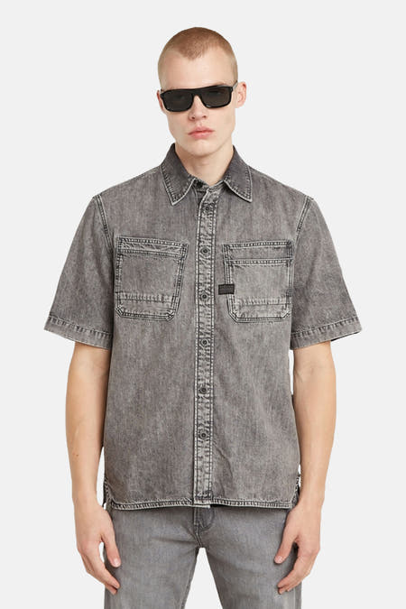 T-shirt de jeans gris G-Star RAW, vu de de l'arrière, avec des manches courtes et une texture stonewashed.