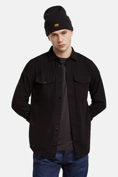 Chemise grise à manches longues de G-Star RAW, avec poches brodées et fermeture à boutons.
