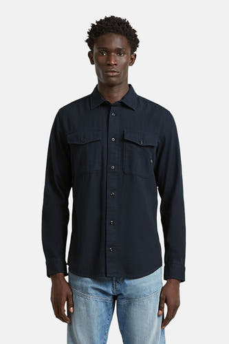 Chemise bleue à manches longues G-Star RAW, vue de dos, portée avec un jean.