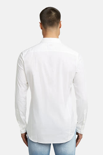 Blouse blanche à manches longues de G-Star RAW, vue de derrière, avec des jeans bleu clair.