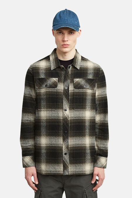 Veste verte de G-Star RAW avec un motif de carreaux noir et beige, des boutons visibles et des poches po poitrine.