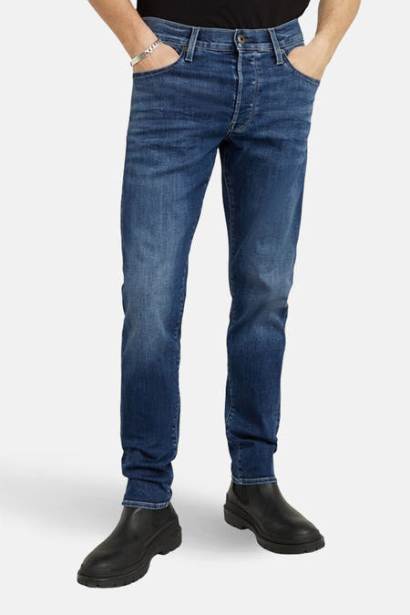 Slim jeans in mid blue denim van G-Star RAW, met knoopsluiting en subtiele wassing.