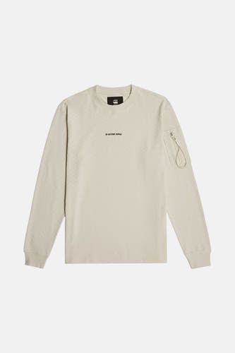 Gilet écru de G-Star RAW, avec des manches longues et une poche à fermeture éclair sur la manche droite.