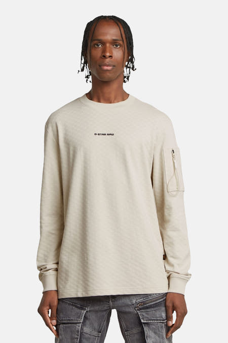 Gilet écru de G-Star RAW avec des manches longues et un petit poche à fermeture éclair.