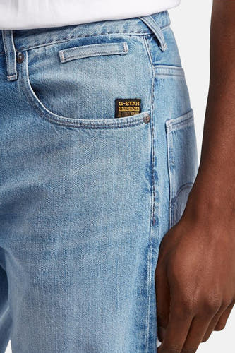 Jean tapered de denim bleu clair G-Star RAW, avec une poche brodée sur le côté.