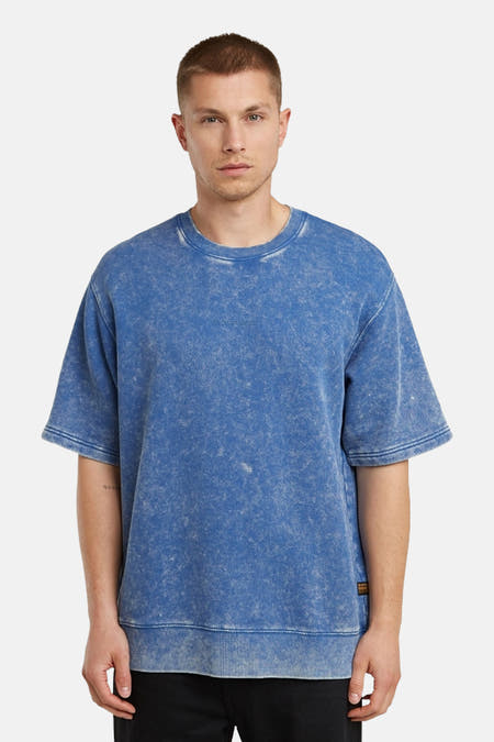 Pull-over bleu G-Star RAW, avec une texture lavée et des manches courtes, vu de derrière.
