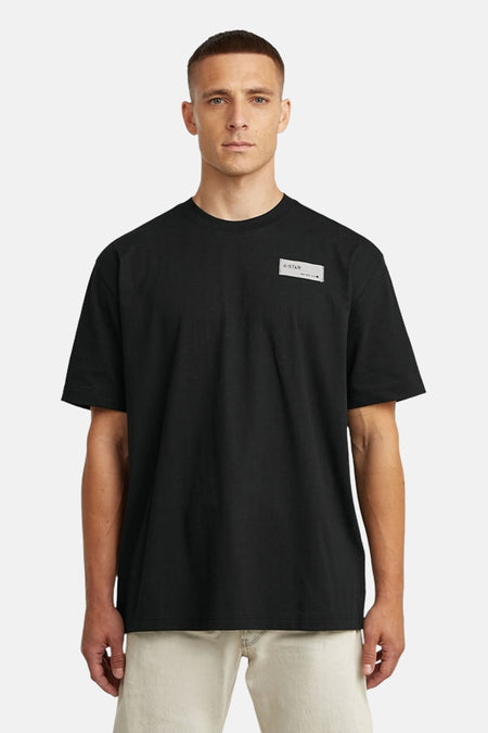 T-shirt noir à manches courtes de G-Star RAW, avec un patch rectangulaire sur la poitrine.