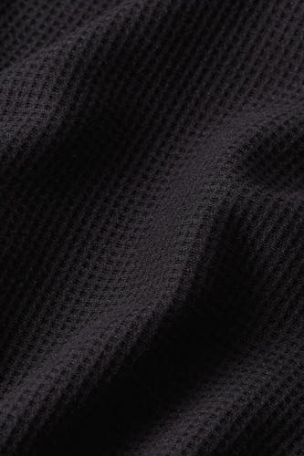 T-shirt noir à manches courtes de G-Star RAW, avec une structure gaufrée épaisse et des plis dans le tissu.