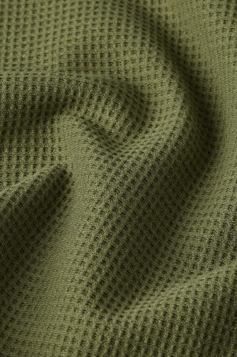 T-shirt vert à manches courtes de G-Star RAW, avec une structure gaufrée frappante et des plis dans le tissu.