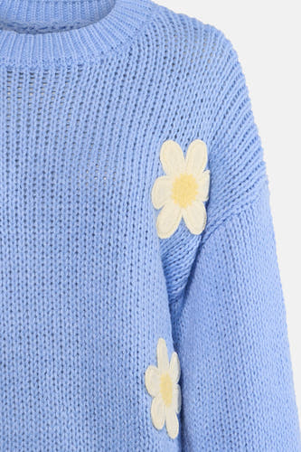 T-shirt bleu avec col rond de HAILYS, orné de fleurs blanches.