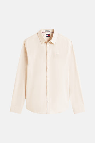 Chemise beige à manches longues de TOMMY JEANS, avec un petit logo sur la poitrine.