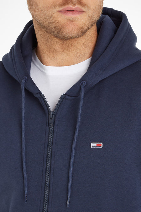 Gilet bleu avec fermeture éclair de TOMMY JEANS, avec cordon et petit logo sur la poitrine.
