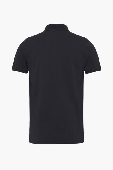 Polo noir de TOMMY JEANS, dos visible, avec des manches courtes et un col classique.