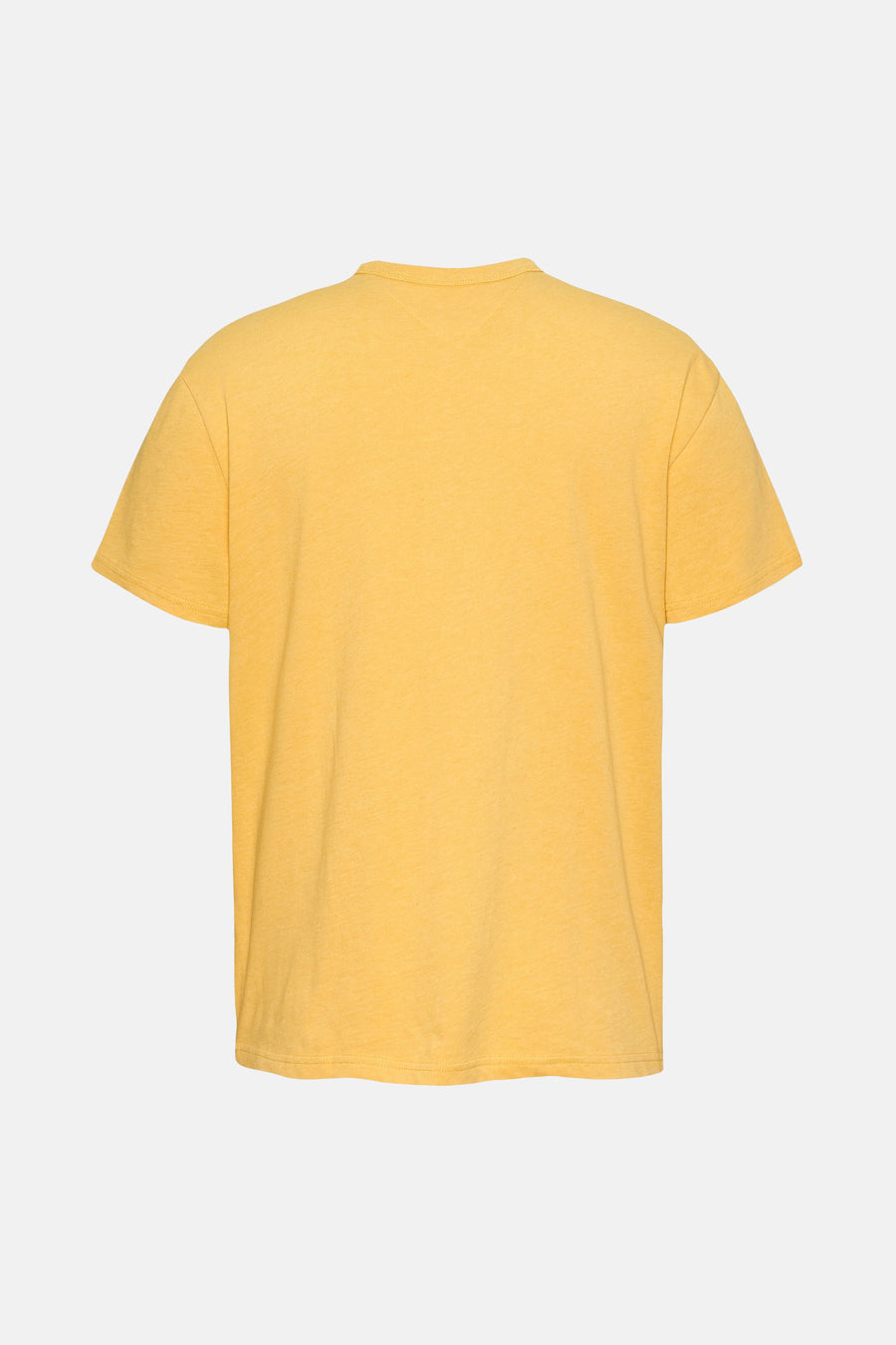 T-shirt jaune à manches courtes de TOMMY JEANS, design uni sur un fond blanc.