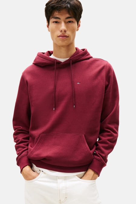 Gilet de Bordeaux avec capuche Tommy Jeans, avec des cordons et une poche sur l'avant.