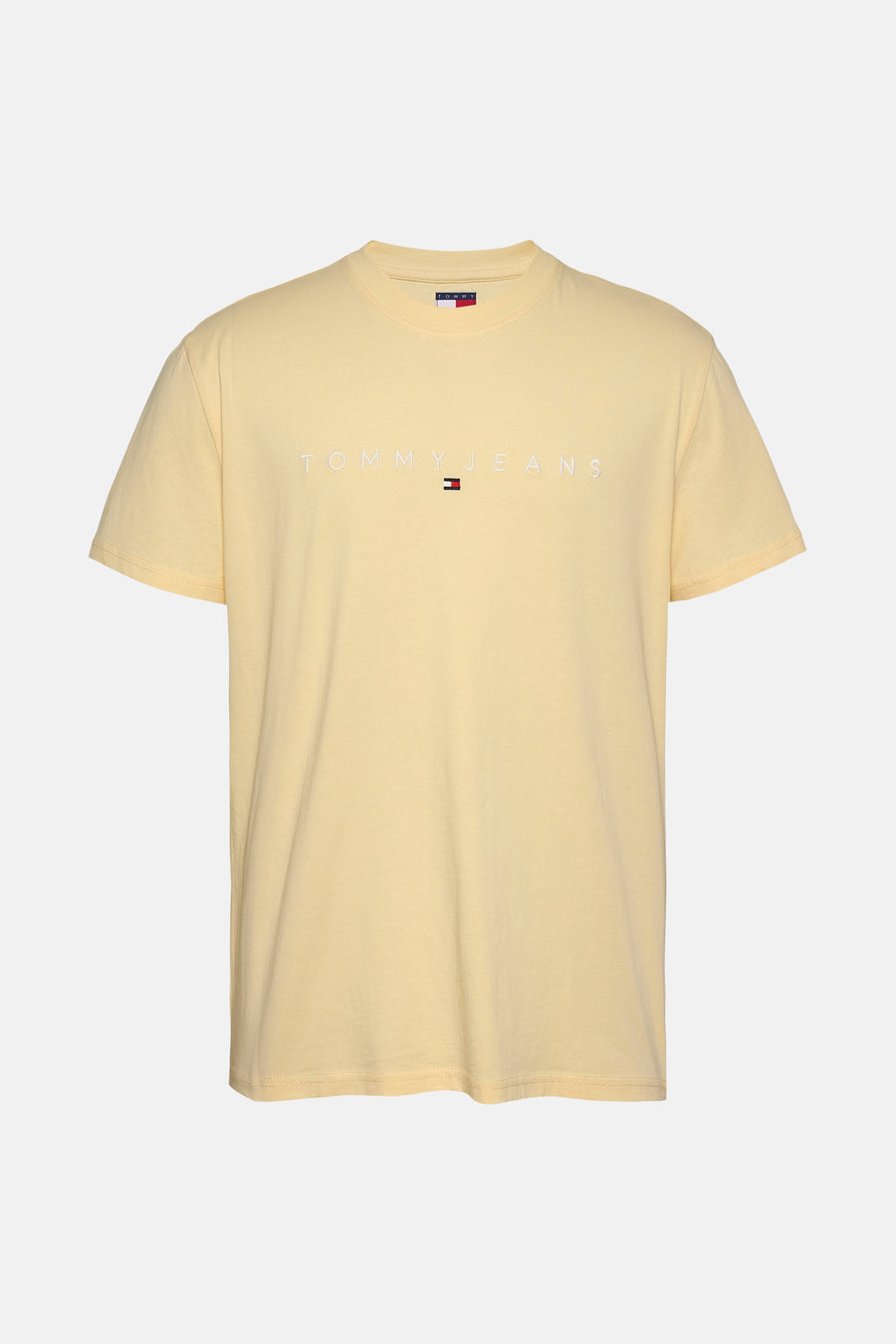 T-shirt jaune à manches courtes de TOMMY JEANS, avec le nom de la marque blanc au-dessus du petit logo.
