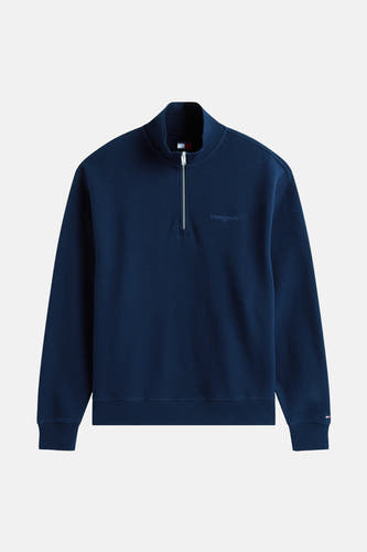 Sweater bleu de TOMMY JEANS, avec une fermeture à glissière et demie et une texture tissée.