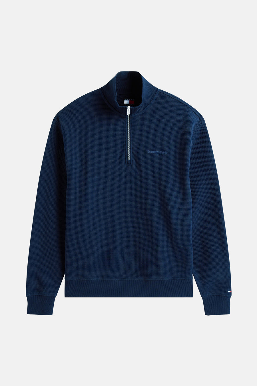 Sweater bleu de TOMMY JEANS, avec une fermeture à glissière et demie et une texture tissée.