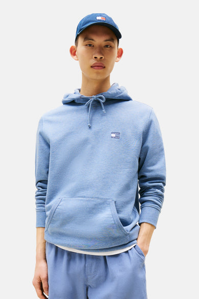 Pull-over bleu avec capuche de Tommy Jeans, avec des cordons et une poche kangourou.