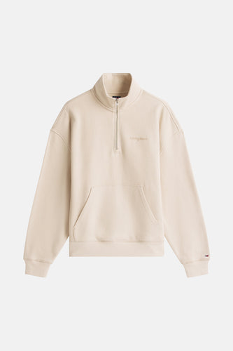 Beige Tommy Jeans sweater met rits en buidelzak.
