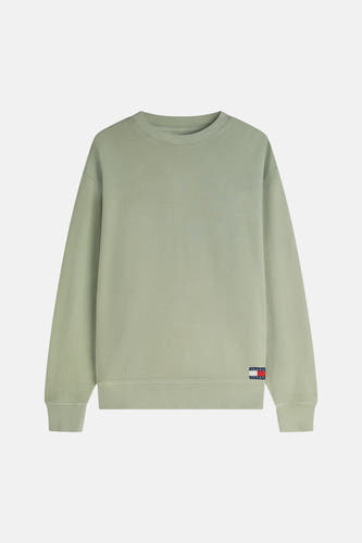 Pull vert de TOMMY JEANS avec texture gaufrée, col rond, bords côtelés et logo drapeau.