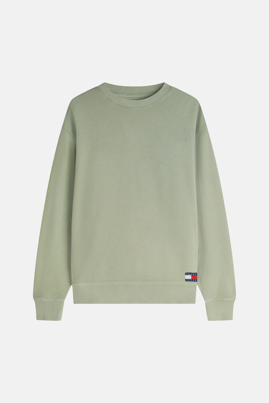 Pull vert de TOMMY JEANS avec texture gaufrée, col rond, bords côtelés et logo drapeau.