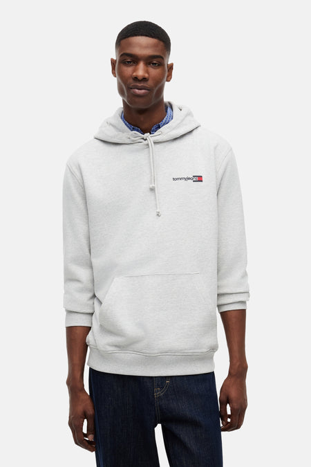 Sweat-shirt à capuche gris de TOMMY JEANS, avec cordons de serrage et petit logo sur la poitrine.