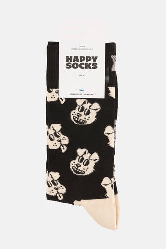 Chaussettes noires de Happy Socks, avec une impression de tête de mort blanche sur toute la chaussette.