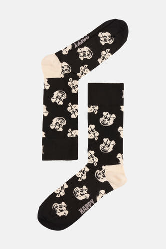 Chaussettes noires de Happy Socks®, avec un motif de têtes de mort blanches.