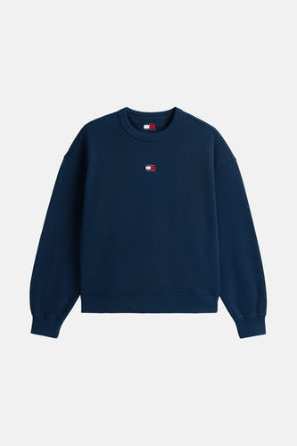 Pull-over bleu de TOMMY JEANS, avec petit logo sur la poitrine et longues manches.