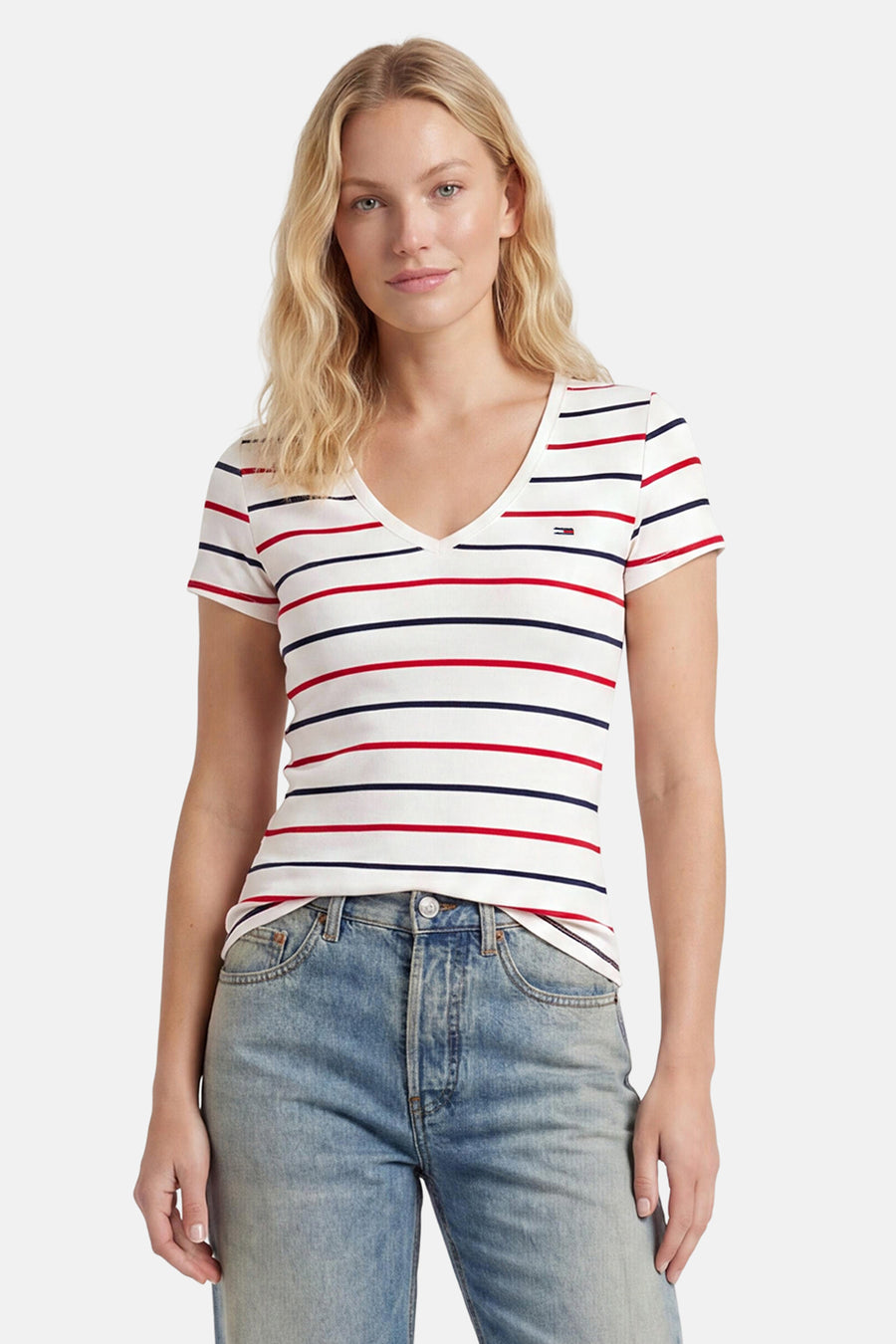 Multicolor gestreepte korte mouwen T-shirt van TOMMY JEANS, met V-hals en klein logo, gedragen met lichtblauwe jeans, front view