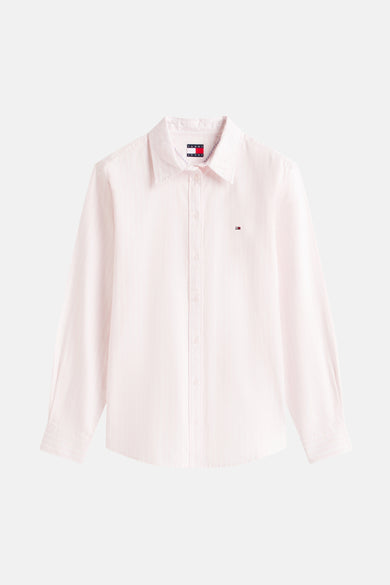 Chemise rose à manches longues de TOMMY JEANS, avec un petit logo sur la poitrine.