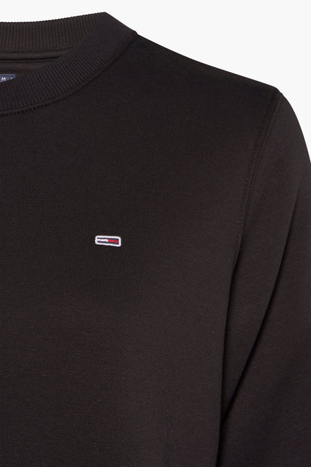Gilet noir de TOMMY JEANS, avec un petit détail de logo sur la poitrine.