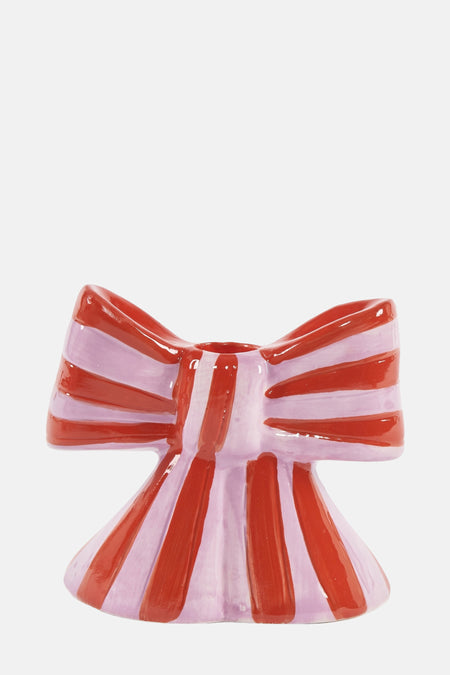Cadeau multicolore de DOIY, sous la forme d'un ruban rayé rouge et violet.