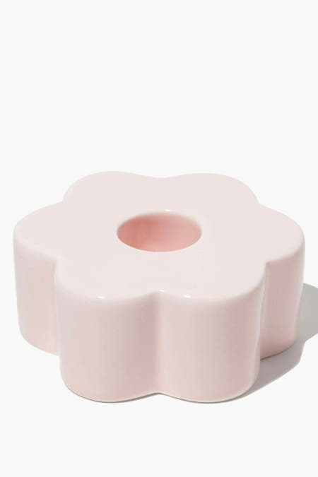 Candélabre à forme de fleur de rose de DOIY, avec une surface brillante et un trou rond au milieu.