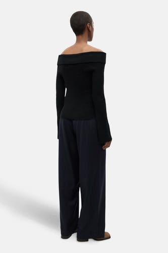 Pantalon bleu avec une rayure blanche d'ENVII, avec des jambes larges et une taille haute.