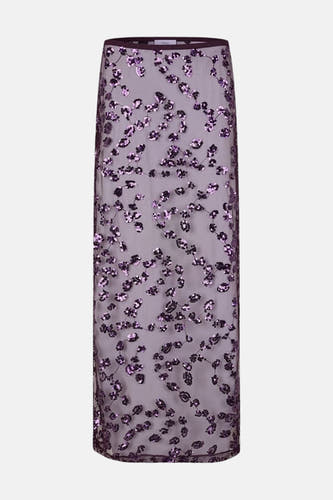 Longue jupe rouge d'ENVII, avec un motif floral de paillettes sur toute la jupe.
