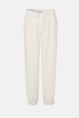 Pantalon blanc ample d'ENVII avec taille élastique et cordons de serrage aux chevilles.