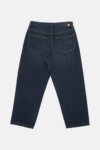Jean denim bleu marine large de DC Shoes, avec un patch logo sur la poche arrière.